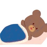 布団で寝る熊